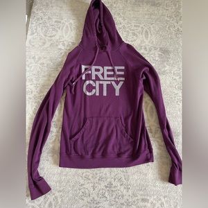 Barely worn purple free city sweatshirt.